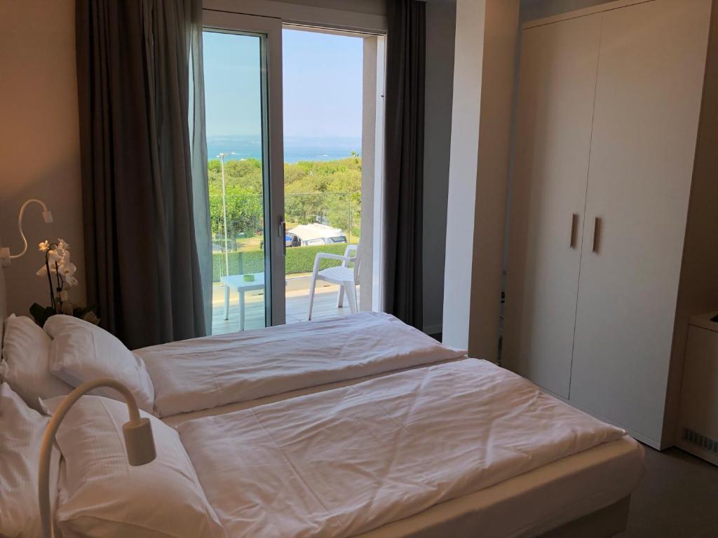 Postel nebo postele na pokoji v ubytování Hotel Paradiso