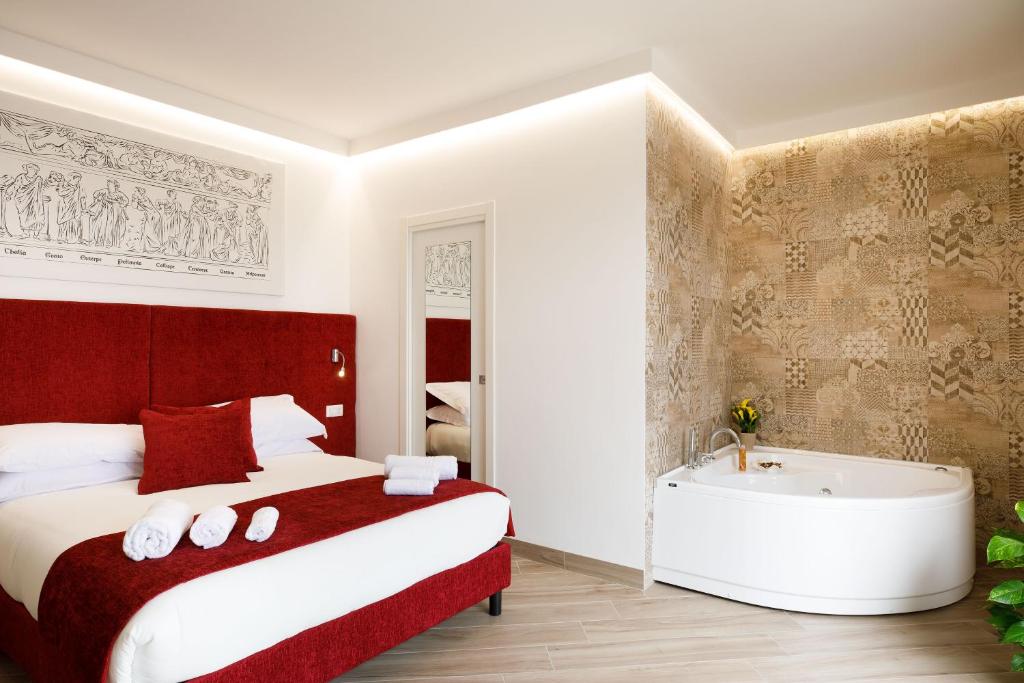 Postel nebo postele na pokoji v ubytování Le Muse Suite