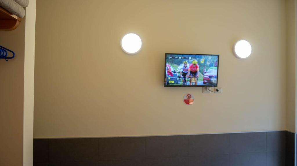 Televízia a/alebo spoločenská miestnosť v ubytovaní tiaspettoaroma