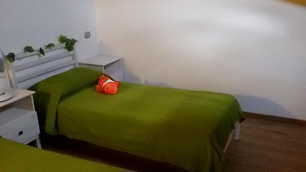 Łóżko lub łóżka w pokoju w obiekcie Casa Luce e Aria