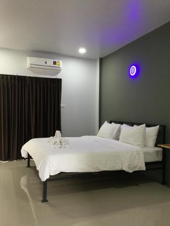 Postel nebo postele na pokoji v ubytování Chan Place Hotel