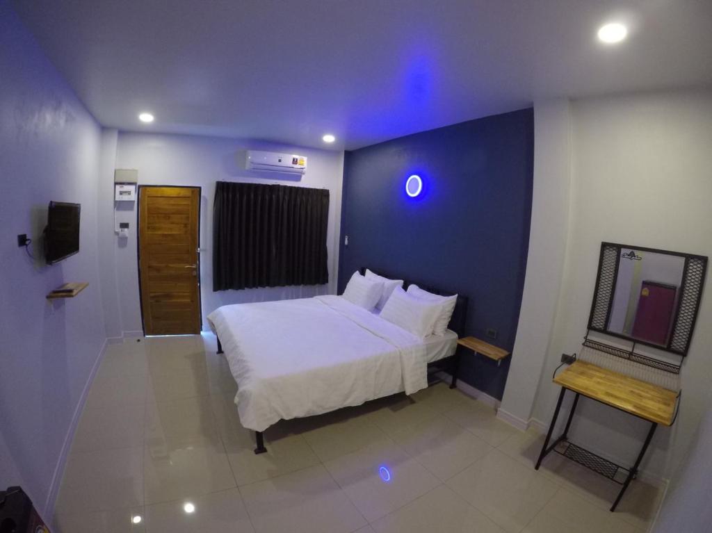 Postel nebo postele na pokoji v ubytování Chan Place Hotel