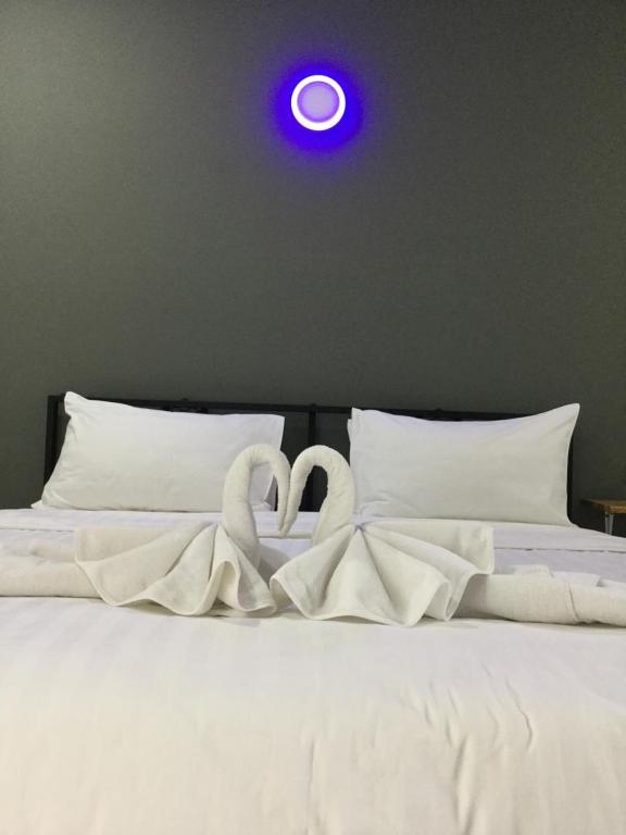Postel nebo postele na pokoji v ubytování Chan Place Hotel