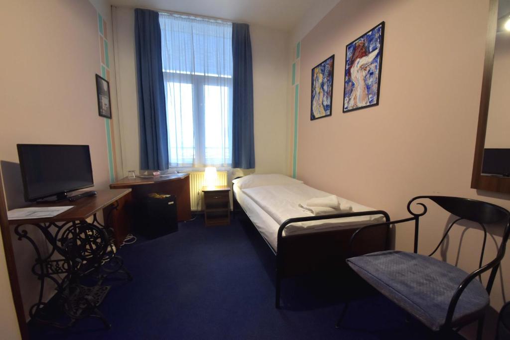 Postel nebo postele na pokoji v ubytování Brioni Boutique Hotel 4*