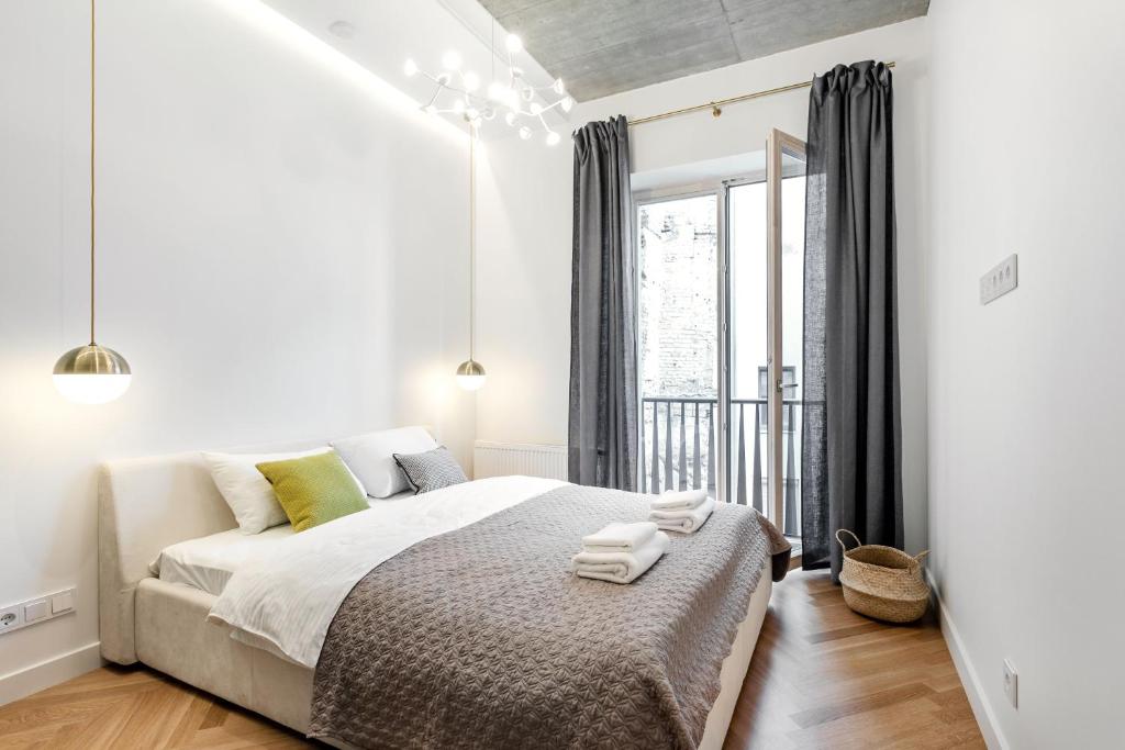 Säng eller sängar i ett rum på 2 Bedr 2 Bath Apartament by Reside Baltic