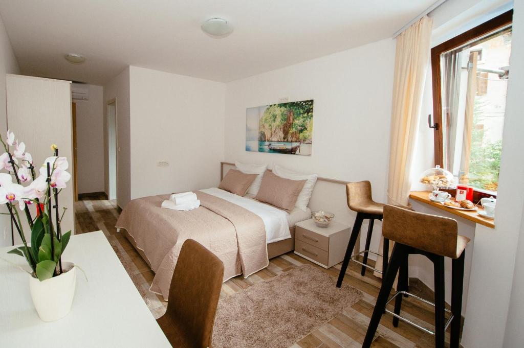Postel nebo postele na pokoji v ubytování Sunny Rooms