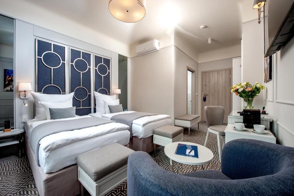 Posteľ alebo postele v izbe v ubytovaní Amber Design Residence