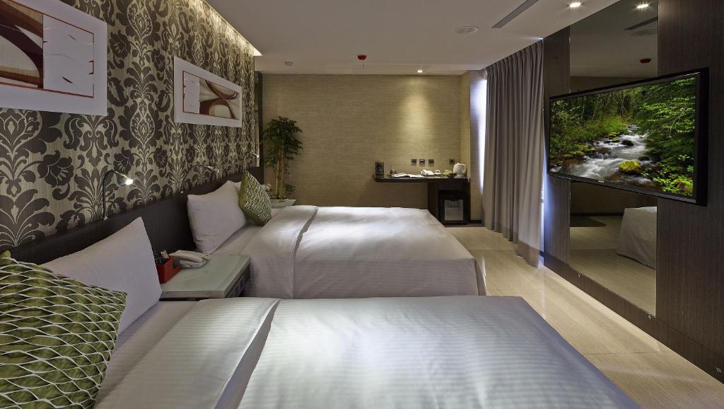 Beauty Hotels Taipei - Hotel B7 tesisinde bir odada yatak veya yataklar