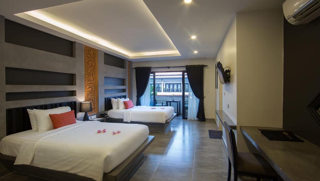 Postel nebo postele na pokoji v ubytování Central Suite Residence