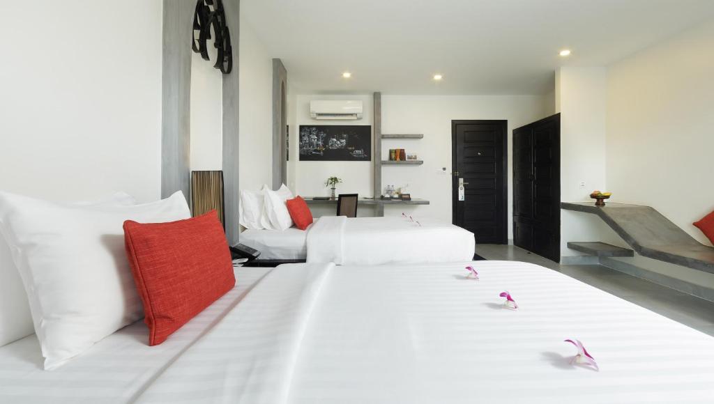 Postel nebo postele na pokoji v ubytování Central Suite Residence