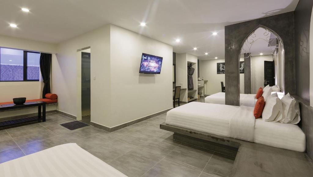 Postel nebo postele na pokoji v ubytování Central Suite Residence