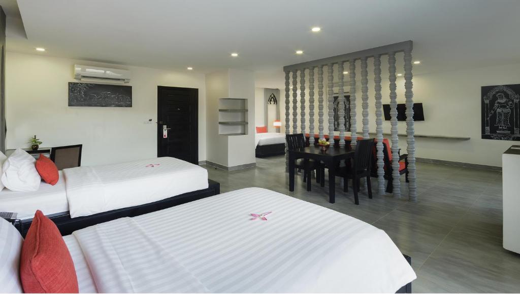 Postel nebo postele na pokoji v ubytování Central Suite Residence