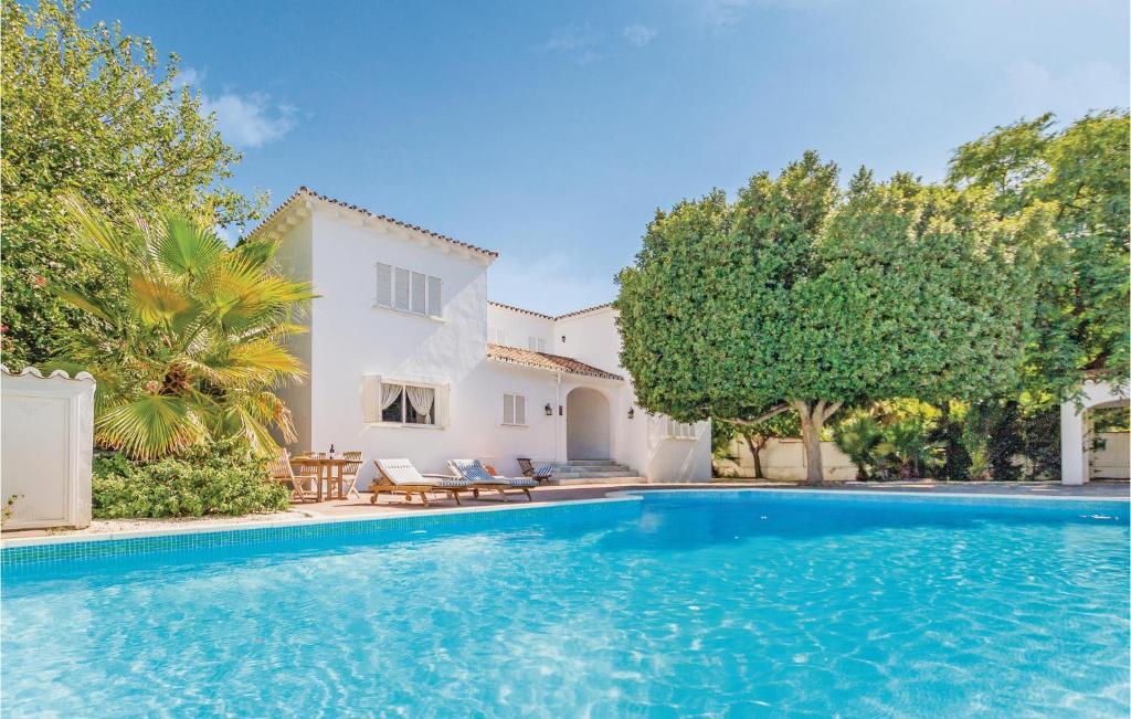 a swimming pool in front of a villa at 7 Bedroom Amazing Home In Mijas Costa in La Cala de Mijas