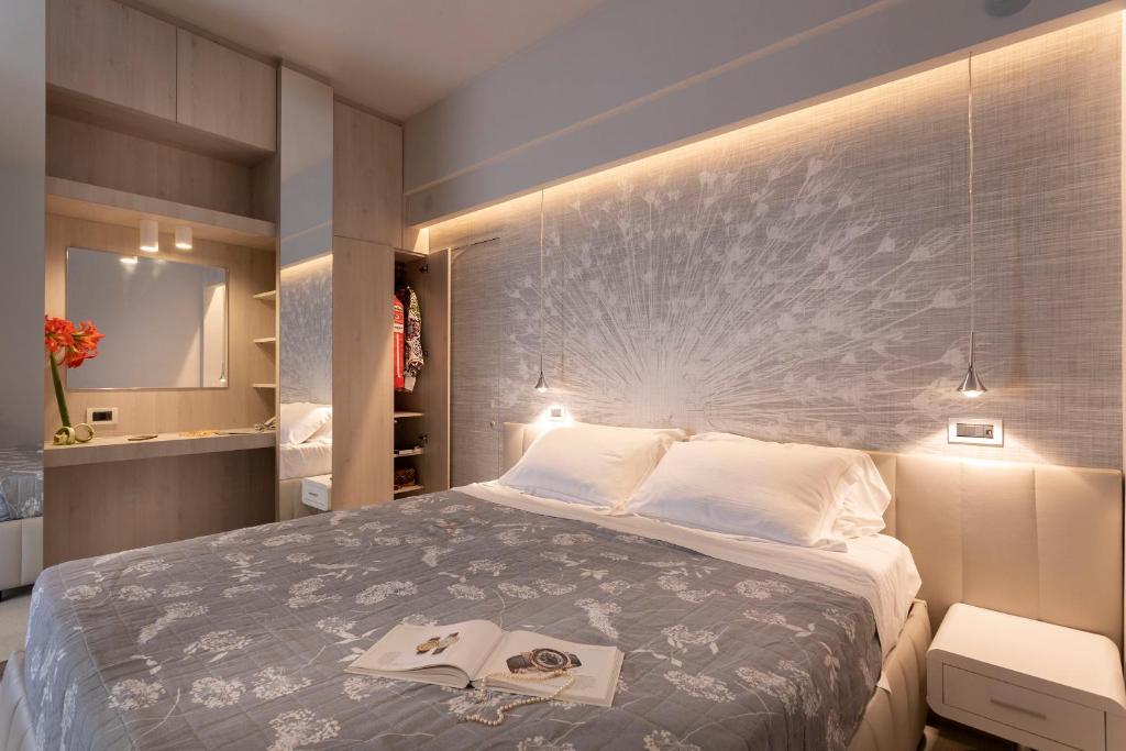 Postel nebo postele na pokoji v ubytování Hotel Ghirlandina