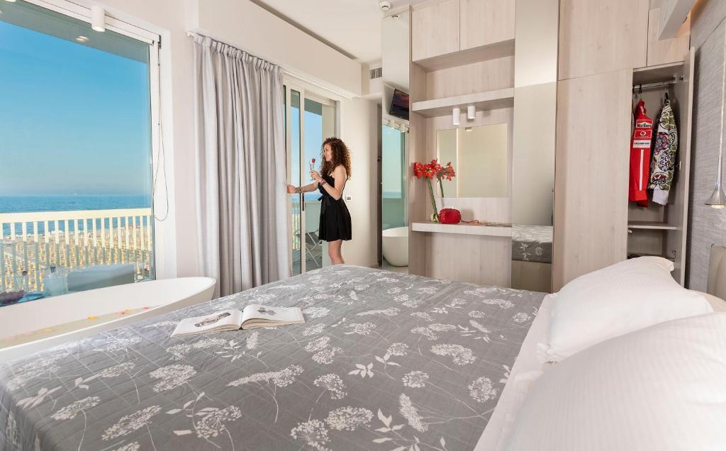 Postel nebo postele na pokoji v ubytování Hotel Ghirlandina
