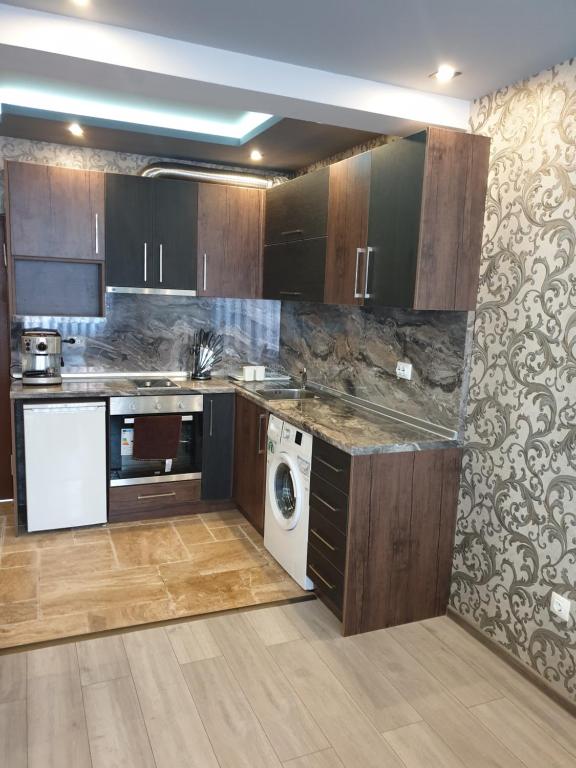 Kuchyň nebo kuchyňský kout v ubytování MitProt Panorama Bay 2 luks apartment 102