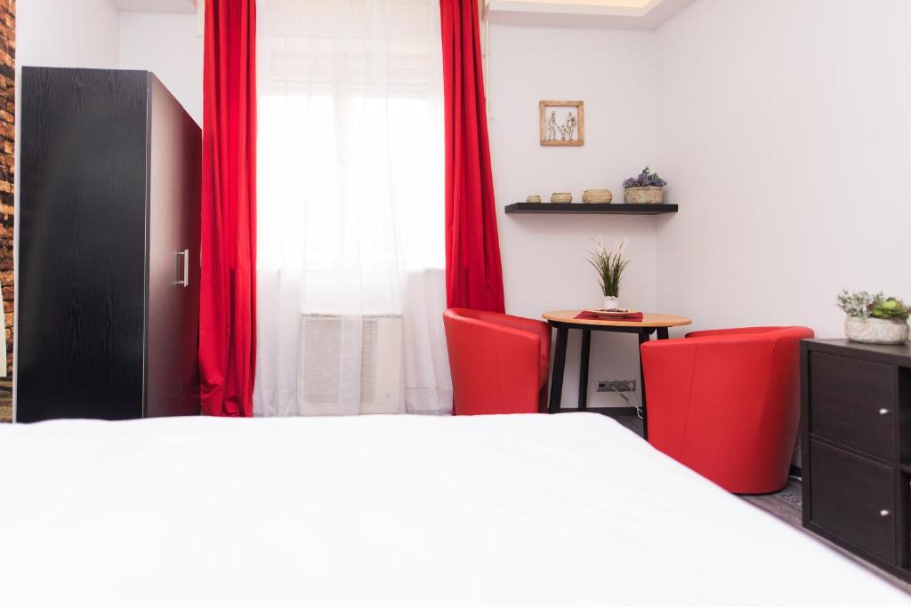 Кровать или кровати в номере NeroRosso Apartment