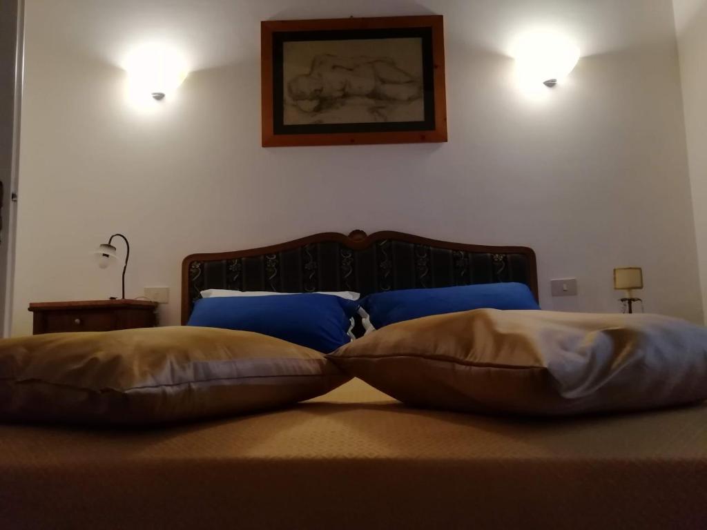 Łóżko lub łóżka w pokoju w obiekcie Al Castello di Leprignano