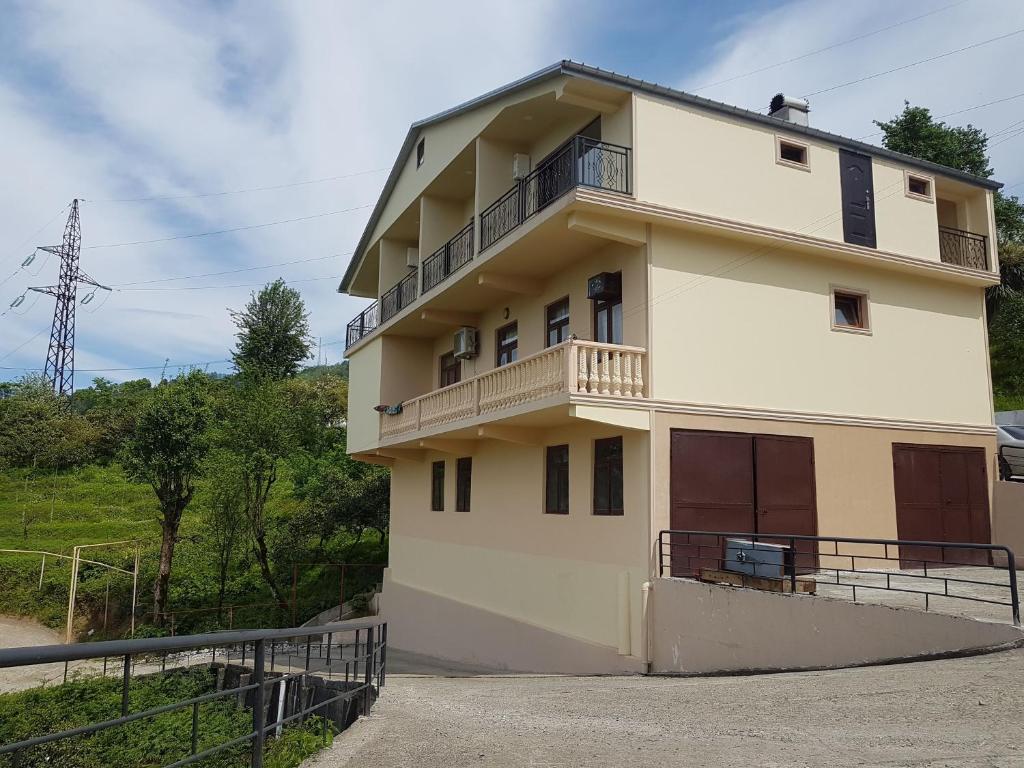 a building with a balcony on the side of it at Iberia 2019 in Batumi