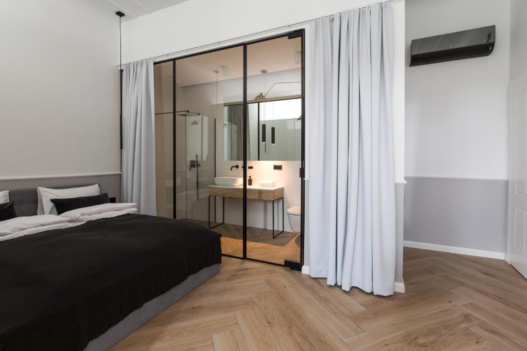 Posteľ alebo postele v izbe v ubytovaní Homewell Boutique Apartments