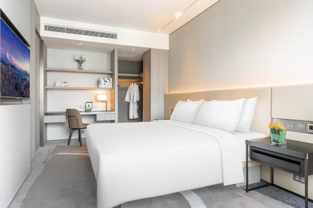 A bed or beds in a room at ALVA HOTEL BY ROYAL