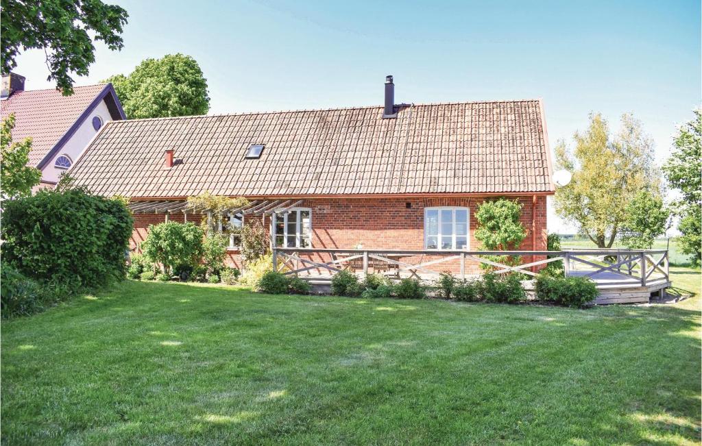 a brick house with a large yard in front of it at Awesome Home In Grsns With Kitchen in Gärsnäs