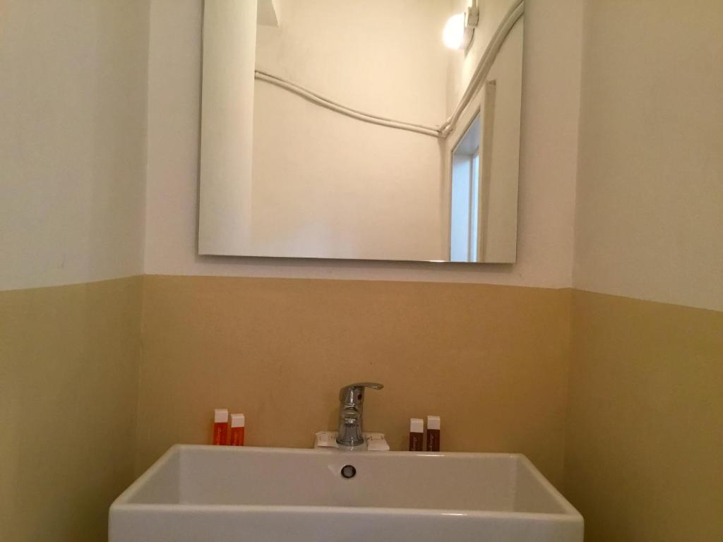 A bathroom at San Firenze Apartment