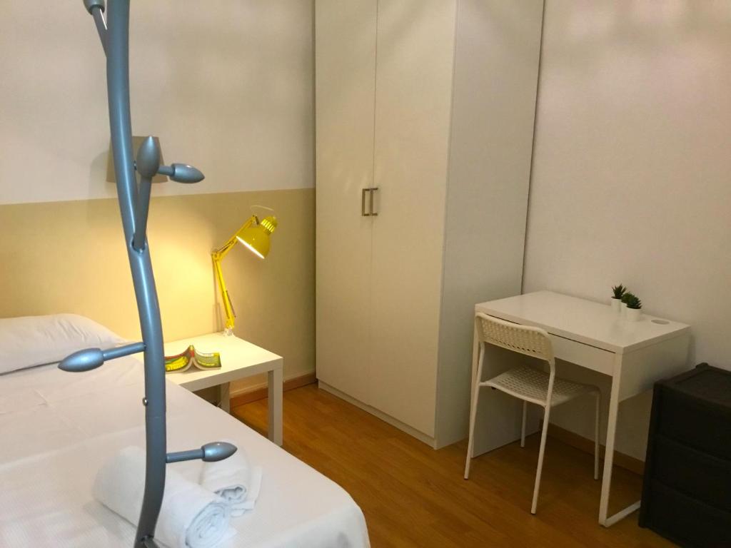 A bed or beds in a room at San Firenze Apartment
