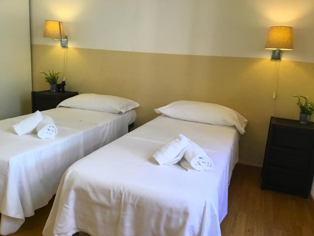 A bed or beds in a room at San Firenze Apartment
