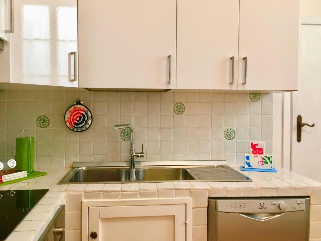 A kitchen or kitchenette at San Firenze Apartment