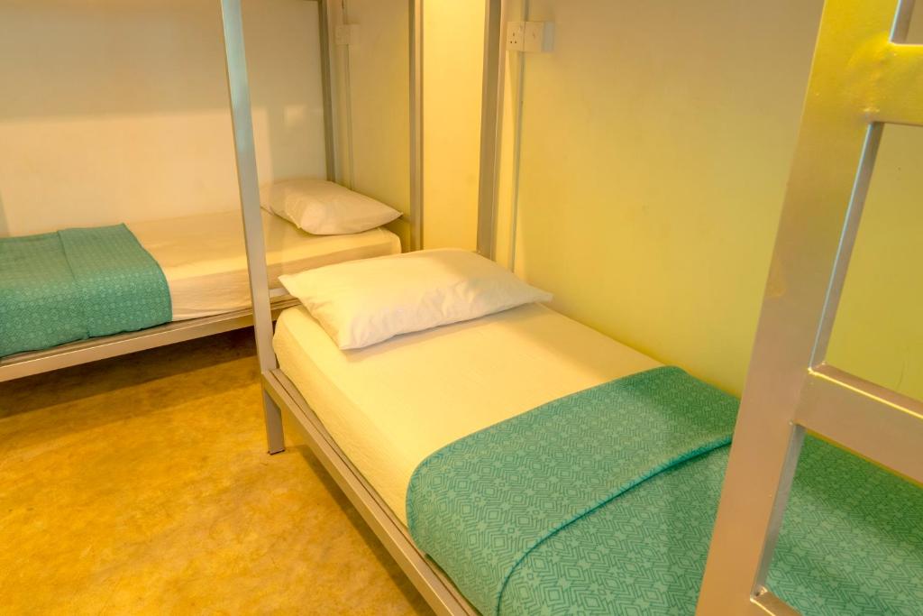 Postel nebo postele na pokoji v ubytování Bunk Station