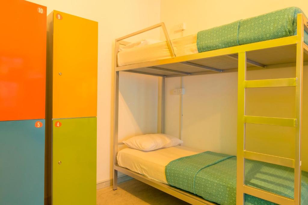 Postel nebo postele na pokoji v ubytování Bunk Station