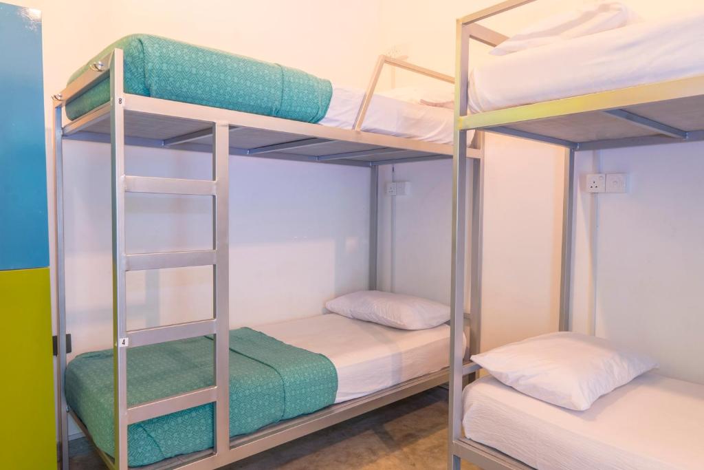 Postel nebo postele na pokoji v ubytování Bunk Station