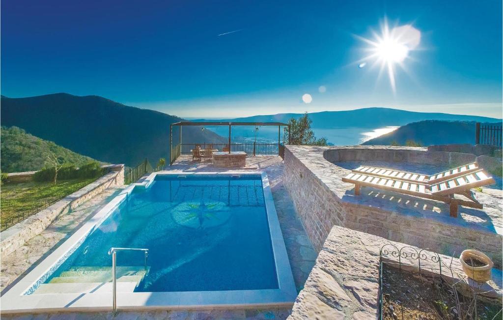 a swimming pool on top of a house at Beautiful Home In Tivat With Wifi in Tivat