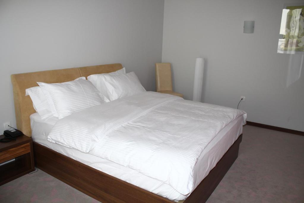 Postel nebo postele na pokoji v ubytování Hotel Franca