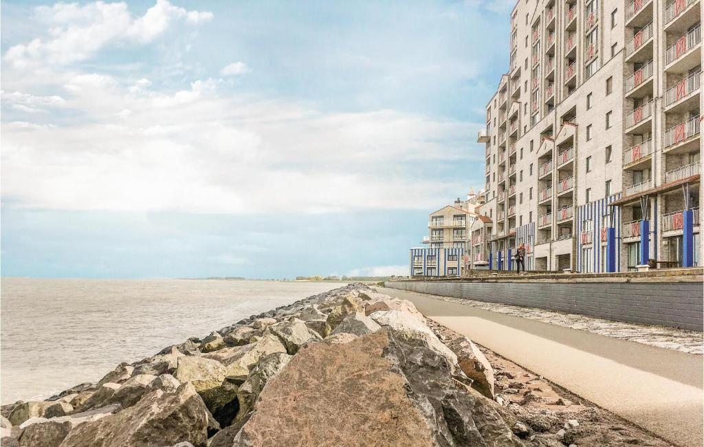 a row of buildings next to a body of water at 1 Bedroom Amazing Apartment In Breskens in Breskens