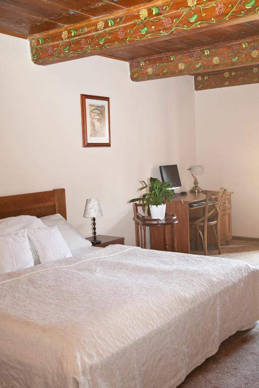 Postel nebo postele na pokoji v ubytování Hotel U Zlatého Lva