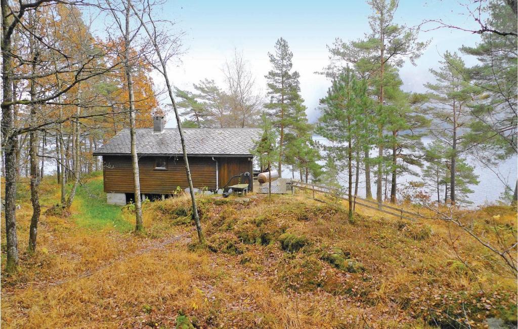 a small house on a hill in the woods at Roligheten in Vanvik