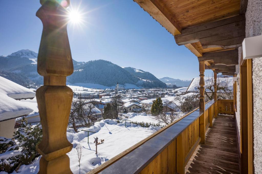 a winter view from the balcony of a cabin at Appartement Waldruhe in Söll