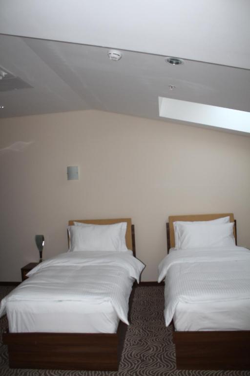 Postel nebo postele na pokoji v ubytování Hotel Franca