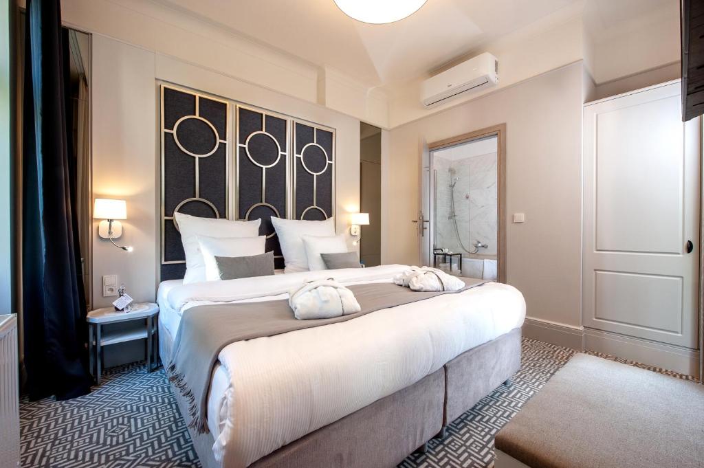 Posteľ alebo postele v izbe v ubytovaní Amber Design Residence