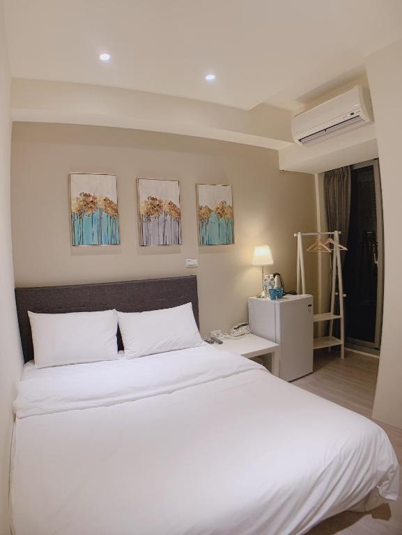 Postel nebo postele na pokoji v ubytování 駐駐逢甲 Shine Residence