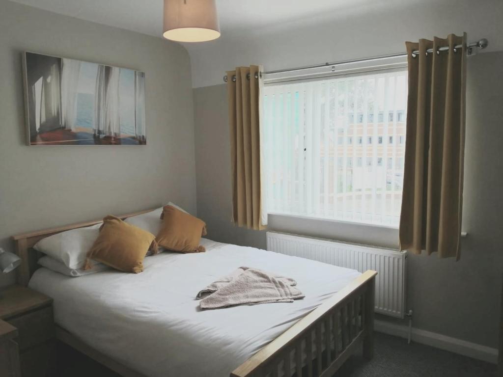 Un pat sau paturi într-o cameră la Liverpool City House