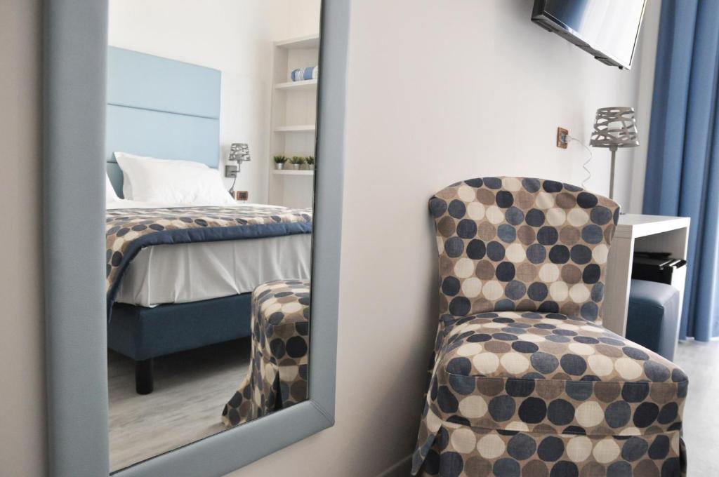 Łóżko lub łóżka w pokoju w obiekcie Regent's Hotel