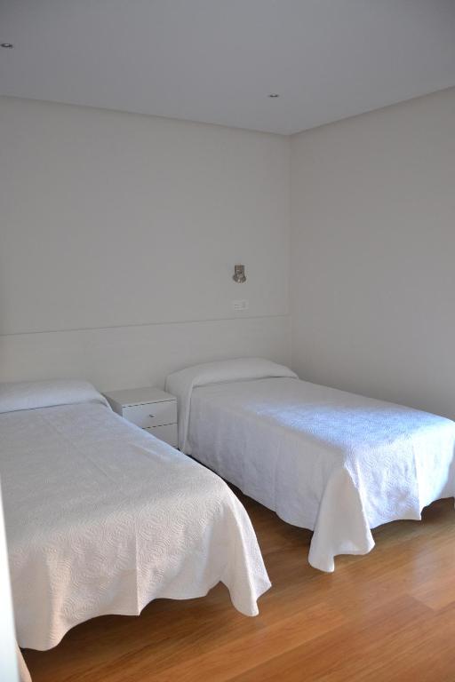 Postel nebo postele na pokoji v ubytování Costa Quebrada Apartamentos
