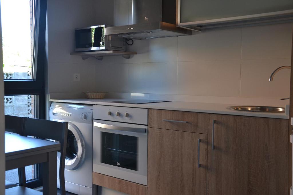 Kuchyň nebo kuchyňský kout v ubytování Costa Quebrada Apartamentos