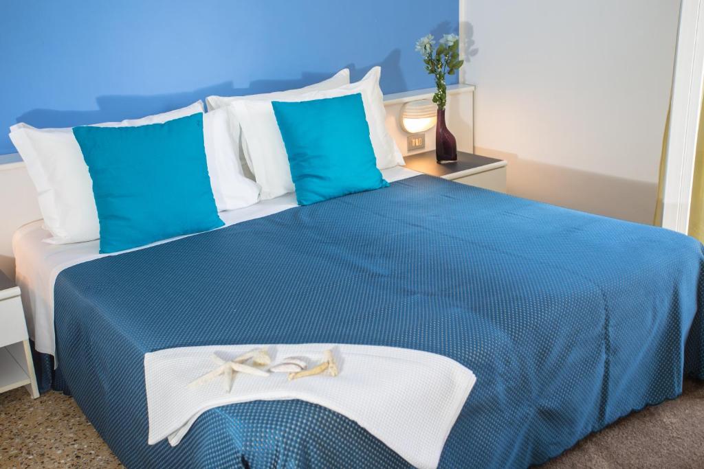 Postel nebo postele na pokoji v ubytování Hotel Beau Soleil