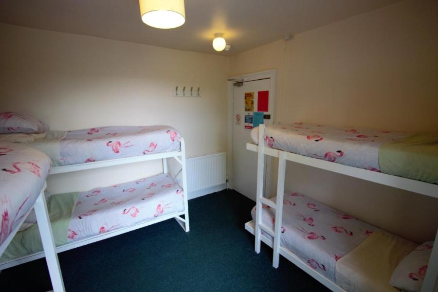 Postel nebo postele na pokoji v ubytování Inverness Student Hotel