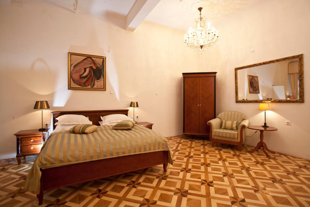 Postel nebo postele na pokoji v ubytování Antiq Palace - Historic Hotels of Europe