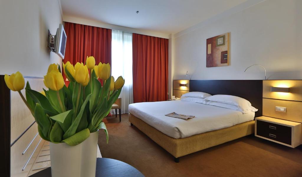 Łóżko lub łóżka w pokoju w obiekcie Best Western Plus Hotel Le Favaglie